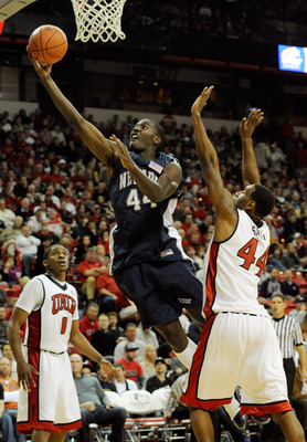 LAS VEGAS - NOVEMBER 18:  Dario Hunt #44 of the Nevada Reno Wolf Pack drives past Darris Santee #44 of the UNLV Rebels during their game at the Thomas & Mack Center November 18, 2009 in Las Vegas, Nevada. UNLV won 88-75.  (Photo by Ethan Miller/Getty Imag