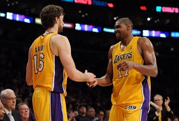 LOS ANGELES, CA - APRIL 20: Pau Gasol #16 and Andrew Bynum #17 of the Los Angeles Lakers celebrate as Bynum comes to the bench while taking on the New Orleans Hornets in Game Two of the Western Conference Quarterfinals in the 2011 NBA Playoffs on April 2