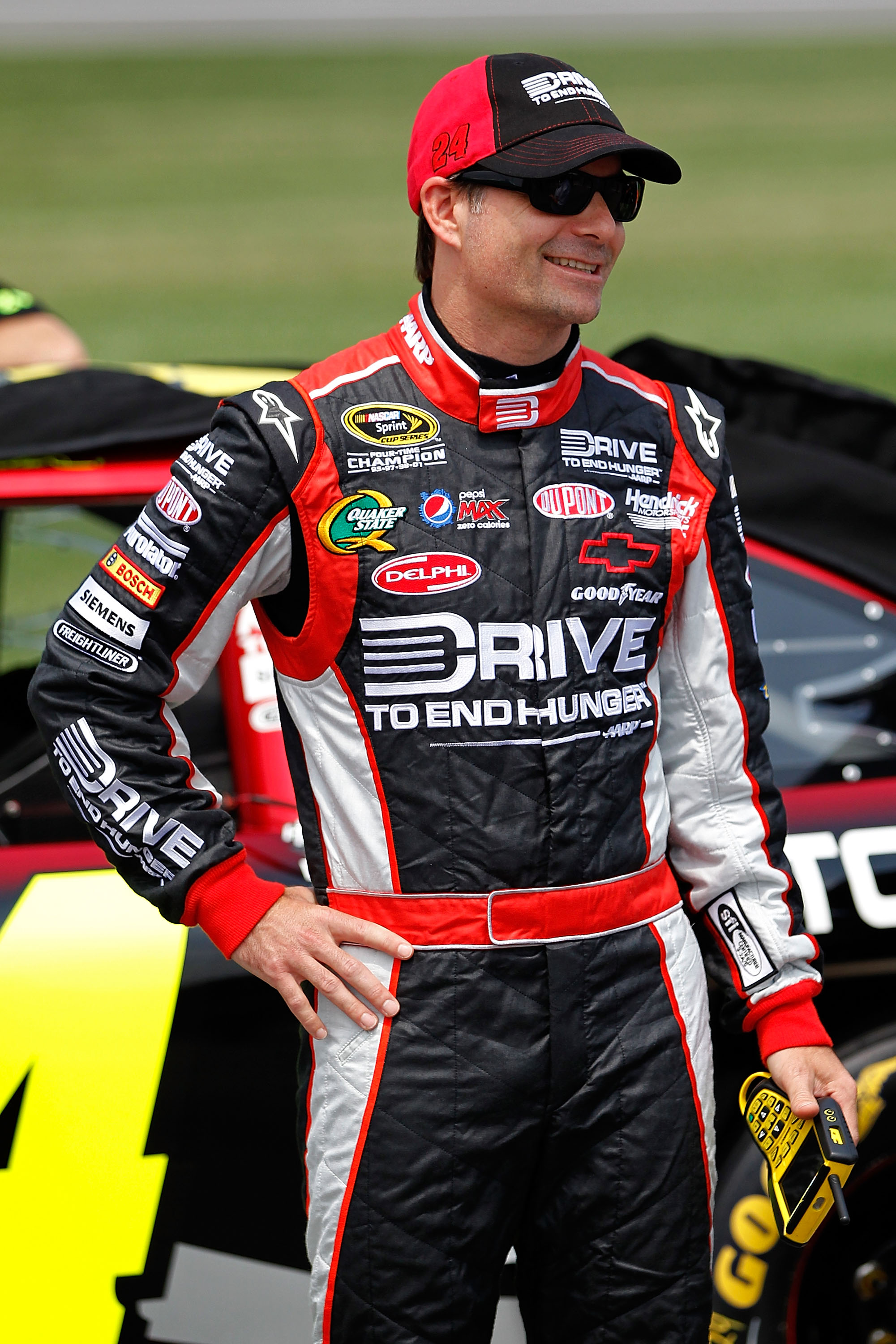 KANSAS CITY, KS - JUNE 04:  Jeff Gordon, driver of the #24 Drive to End Hunger Chevrolet, stands on the grid during qualifying for the NASCAR Sprint Cup Series STP 400 at Kansas Speedway on June 4, 2011 in Kansas City, Kansas.  (Photo by Geoff Burke/Getty