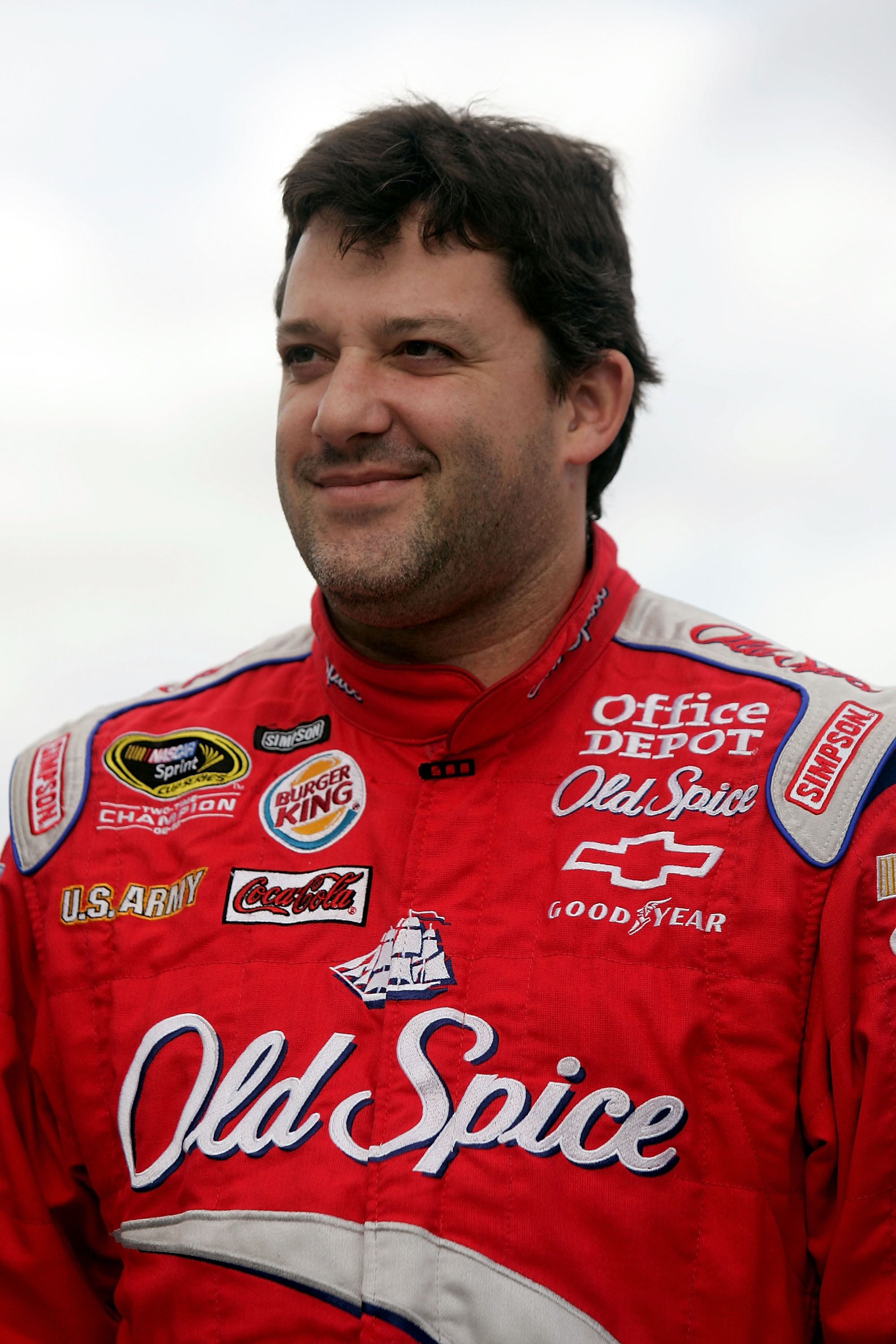 MARTINSVILLE, VA - OCTOBER 23:  Tony Stewart, driver of the #14 Old Spice/Office Depot Chevrolet, stands on the grid during qualifying for the NASCAR Sprint Cup Series TUMS Fast Relief 500 at Martinsville Speedway on October 23, 2009 in Martinsville, Virg