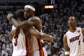 Miami, FLORIDA, USA. 12th June, 2011. Dallas Mavericks' Dirk Nowitzki (L)  celebrates with teammate Tyson Chandler near the end of Game 6 of the NBA  Finals basketball series against the Miami Heat