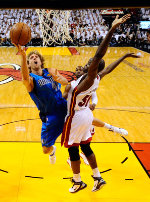 Miami, FLORIDA, USA. 12th June, 2011. Dallas Mavericks' Dirk Nowitzki (L)  celebrates with teammate Tyson Chandler near the end of Game 6 of the NBA  Finals basketball series against the Miami Heat