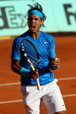 PARIS, FRANCE - JUNE 01:  Rafael Nadal of Spain celebrates a point during the men's singles quarterfinal match between Rafael Nadal of Spain and Robin Soderling of Sweden on day eleven of the French Open at Roland Garros on June 1, 2011 in Paris, France. 