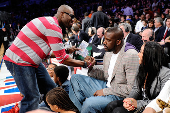 LOS ANGELES, CA - FEBRUARY 19:  NFL player Terrell Owens shakes hands with Shaquille O'Neal of the Boston Celtics as they attend NBA All-Star Saturday night presented by State Farm at Staples Center on February 19, 2011 in Los Angeles, California.  NOTE T