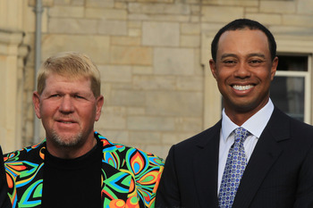 ST ANDREWS, SCOTLAND - JULY 13:  John Daly and Tiger Woods pose for a photo prior to the past champions dinner before the 139th Open Championship on the Old Course, St Andrews on July 13, 2010 in St Andrews, Scotland.  (Photo by David Cannon/Getty Images)