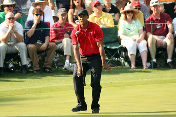 AUGUSTA, GA - APRIL 10:  Tiger Woods reacts to missing his putt on the 16th hole during the final round of the 2011 Masters Tournament at Augusta National Golf Club on April 10, 2011 in Augusta, Georgia.  (Photo by Andrew Redington/Getty Images)
