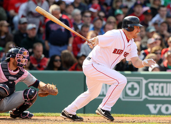 BOSTON, MA - MAY 08:  J.D. Drew #7 of the Boston Red Sox hits an RBI single  in the fifth inning as Drew Butera #41 of the Minnesota Twins catches on May 8, 2011 at Fenway Park in Boston, Massachusetts.  (Photo by Elsa/Getty Images)