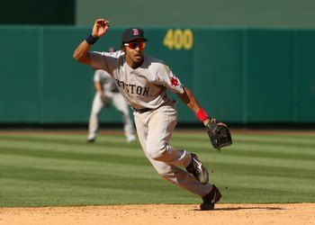 ANAHEIM, CA - MAY 14: Shortstop Julio Lugo #23 of the Boston Red Sox plays in the field against the Los Angeles Angels of Anaheim on May 14, 2009 at Angel Stadium in Anaheim, California.   The Angels won 5-4 in 12 innings.  (Photo by Stephen Dunn/Getty Im