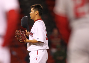 BOSTON, MA - MAY 04:  Daisuke Matsuzaka #18 of the Boston Red Sox reacts after giving up a single to Peter Bourjos #25 of the Los Angeles Angels of Anaheim at Fenway Park on May 4, 2011 in Boston, Massachusetts. (Photo by Jim Rogash/Getty Images)
