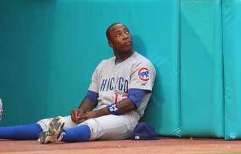 Chicago Cubs' Alfonso Soriano sprays the fans in the bleachers with  champagne as he celebrates after the Cubs beat the St. Louis Cardinals 5-4  to clinch the N.L. Central Division at Wrigley