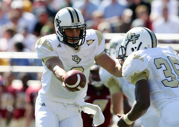 CHESTNUT HILL, MA - SEPTEMBER 20: Michael Greco #2 of the Central Florida Knights hands the ball off to Ronnie Weaver #35 in the first half against the Boston College Eagles on September 20, 2008 at Alumni Stadium in Chestnut Hill, Massachusetts. (Photo