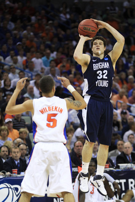 NEW ORLEANS, LA - MARCH 24:  Jimmer Fredette #32 of the Brigham Young Cougars shoots over Scottie Wilbekin #5 of the Florida Gators in the second half during the Southeast regional of the 2011 NCAA men's basketball tournament at New Orleans Arena on March
