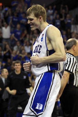 CHARLOTTE, NC - MARCH 20:  Kyle Singler #12 of the Duke Blue Devils reacts while taking on the Michigan Wolverines in the second half during the third round of the 2011 NCAA men's basketball tournament at Time Warner Cable Arena on March 20, 2011 in Charl