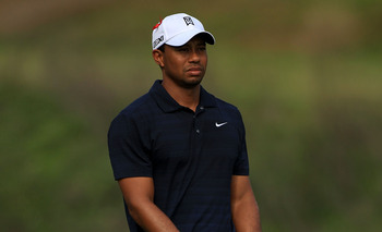 PONTE VEDRA BEACH, FL - MAY 12:  Tiger Woods watches his approach shot on the seventh hole during the first round of THE PLAYERS Championship held at THE PLAYERS Stadium course at TPC Sawgrass on May 12, 2011 in Ponte Vedra Beach, Florida.  (Photo by Stre