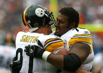 CHICAGO - SEPTEMBER 20: Max Starks #78 of the Pittsburgh Steelers hugs teammate Aaron Smith #91 before a game against the Chicago Bears on September 20, 2009 at Soldier Field in Chicago, Illinois. The Bears defeated the Steelers 17-14. (Photo by Jonathan