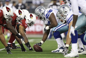 GLENDALE, AZ - DECEMBER 25:  Center Andre Gurode #65 of the Dallas Cowboys prepares to snap the ball against the Arizona Cardinals during the NFL game at the University of Phoenix Stadium on December 25, 2010 in Glendale, Arizona. The Cardinals defeated t