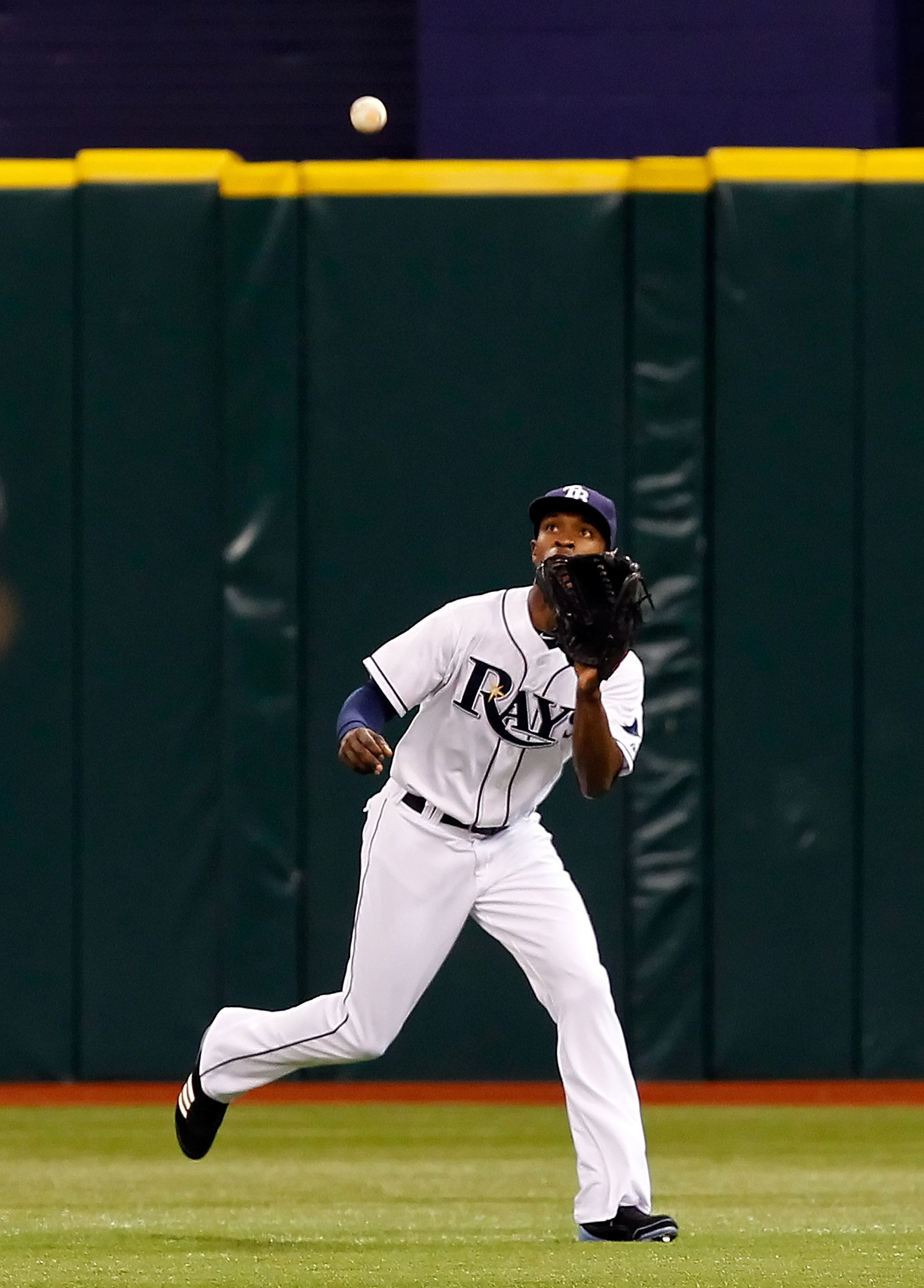 ST. PETERSBURG, FL - MAY 16:  Outfielder B.J. Upton #2 of the Tampa Bay Rays catches a fly ball against the New York Yankees during the game at Tropicana Field on May 16, 2011 in St. Petersburg, Florida.  (Photo by J. Meric/Getty Images)