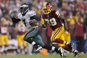 LANDOVER, MD - NOVEMBER 15:  Michael Vick #7 of the Philadelphia Eagles makes a break past Brian Orakpo #98 of the Washington Redskins on November 15, 2010 at FedExField in Landover, Maryland.  (Photo by Chris McGrath/Getty Images)