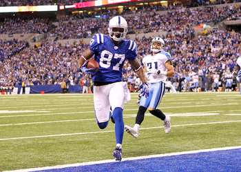 INDIANAPOLIS - JANUARY 02:  Reggie Wayne #87 of the Indianapolis Colts runs for a touchdown during NFL game against the Tennessee Titans at Lucas Oil Stadium on January 2, 2011 in Indianapolis, Indiana.  (Photo by Andy Lyons/Getty Images)