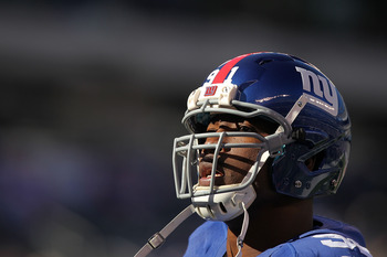 EAST RUTHERFORD, NJ - NOVEMBER 28: Justin Tuck #91 of the New York Giants looks on before the game against the Jacksonville Jaguars during their game on November 28, 2010 at The New Meadowlands Stadium in East Rutherford, New Jersey.  (Photo by Al Bello/G