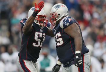 FOXBORO, MA - JANUARY 02:  Jerod Mayo #51 of the New England Patriots congratulates Vince Wilfork #75 in the second half against the Miami Dolphins on January 2, 2011 at Gillette Stadium in Foxboro, Massachusetts.  (Photo by Elsa/Getty Images)