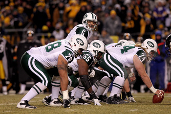 PITTSBURGH, PA - JANUARY 23:  Quarterback Mark Sanchez #6 of the New York Jets calls signals at the line of scgimmage behind Wayne Hunter #78, Brandon Moore #65 and center Nick Mangold #74 against the Pittsburgh Steelers during the 2011 AFC Championship g
