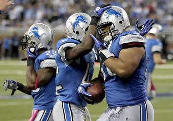 DETROIT - OCTOBER 10: Ndamukong Suh #90 of the Detroit Lions and teammates celebrate a fourth quarter interception against the St. Louis Rams on October 10, 2010 at Ford Field in Detroit, Michigan. Detroit won the game 44-6. (Photo by Gregory Shamus/Getty