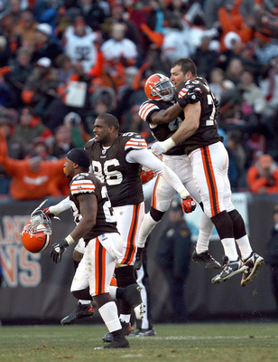 CLEVELAND - NOVEMBER 28:  Defensive players Clifton Smith #28, David Bowens #96, T.J. Ward #43 and Joe Thomas #73 of the Cleveland Browns celebrate after their game against the Carolina Panthers at Cleveland Browns Stadium on November 28, 2010 in Clevelan
