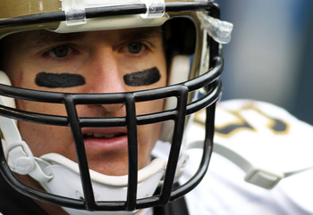 SEATTLE, WA - JANUARY 08:  Quarterback Drew Brees #9 of the New Orleans Saints looks on against the Seattle Seahawks during the 2011 NFC wild-card playoff game at Qwest Field on January 8, 2011 in Seattle, Washington.  (Photo by Jonathan Ferrey/Getty Imag
