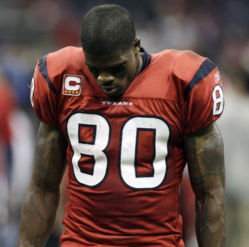 HOUSTON, TX - DECEMBER 13:  A dejected Andre Johnson #80 of the Houston Texans walks off the field after Houston was defeated by Baltimore in overtime at Reliant Stadium on December 13, 2010 in Houston, Texas.  (Photo by Bob Levey/Getty Images)