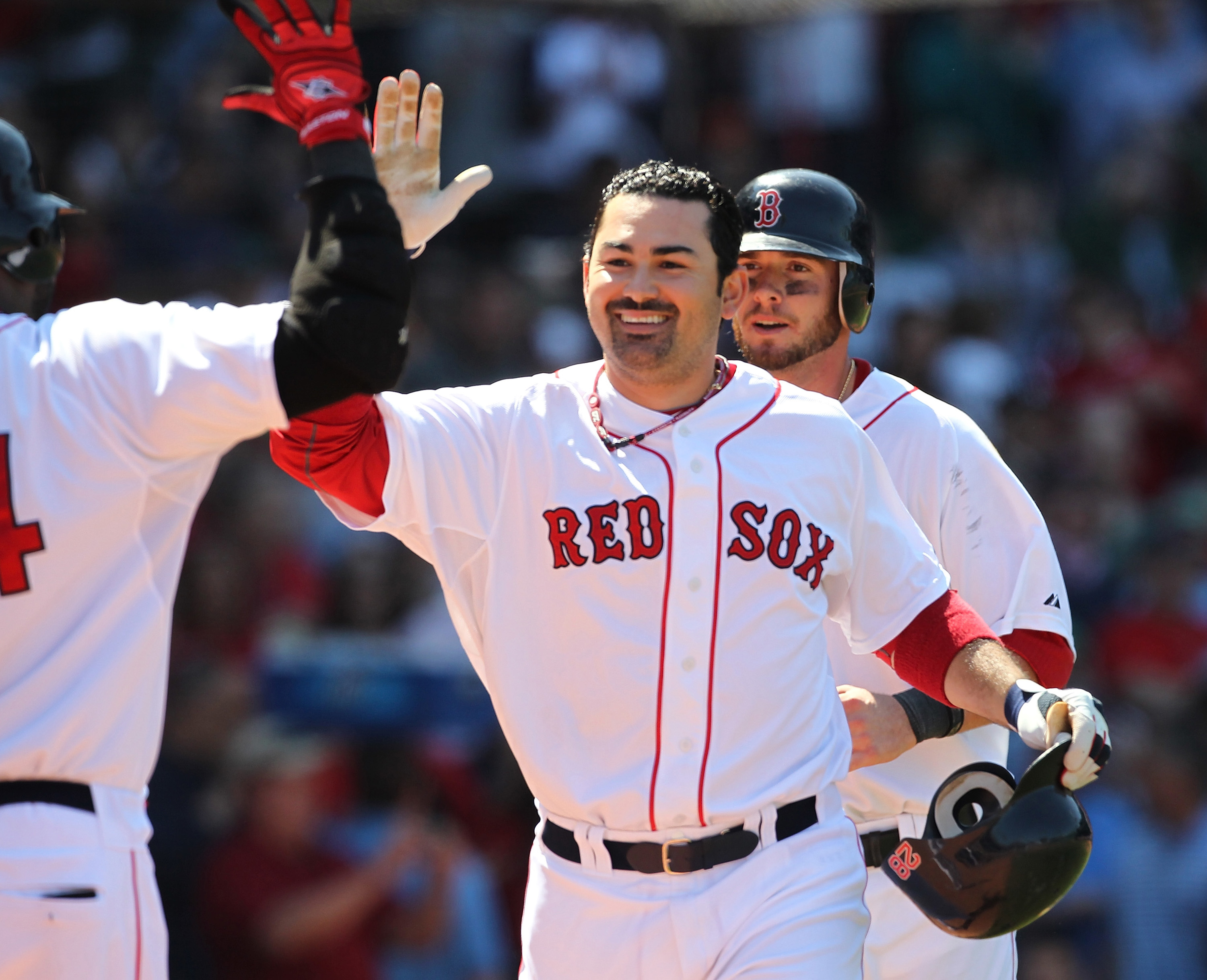BOSTON, MA - JUNE 5:  Adrian Gonzalez #28 of the Boston Red Sox celebrates after connecting for a two-run home against the Oakland Athletics at Fenway Park on June 5, 2011 in Boston, Massachusetts.  (Photo by Jim Rogash/Getty Images)
