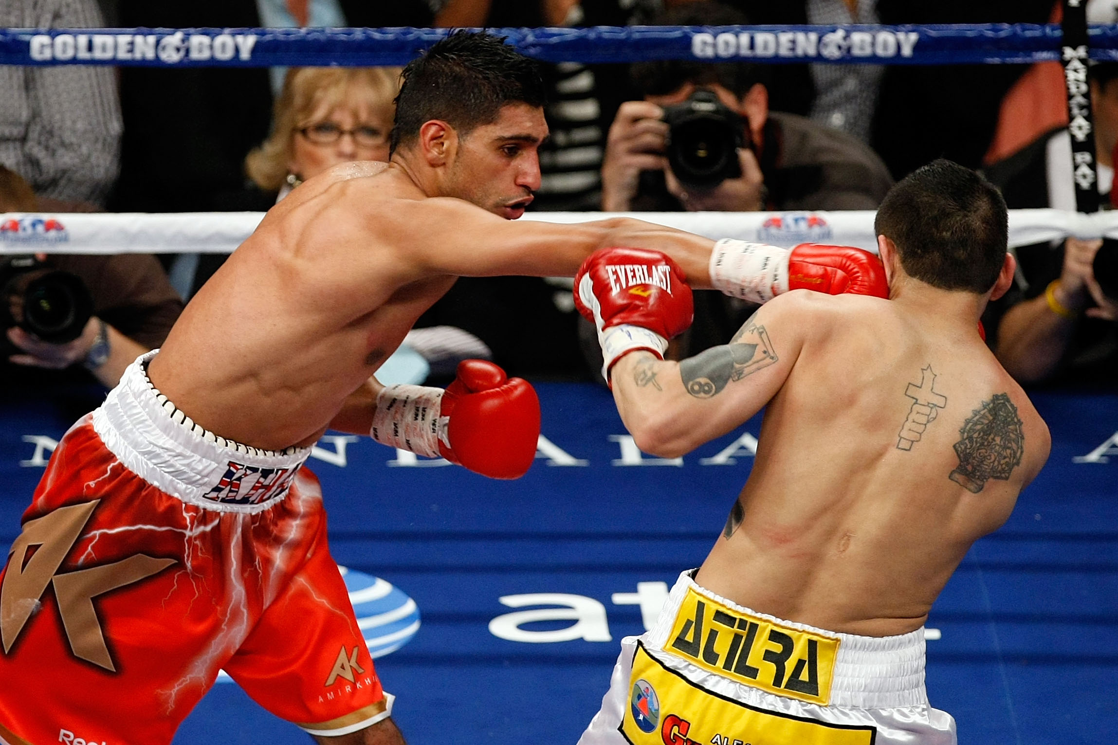 LAS VEGAS - DECEMBER 11: (L-R) Amir Khan of England connects with a right to the face of Marcos Maidana of Argentina during the WBA super lightweight title fight at Mandalay Bay Events Center on December 11, 2010 in Las Vegas, Nevada. (Photo by Ethan Mi