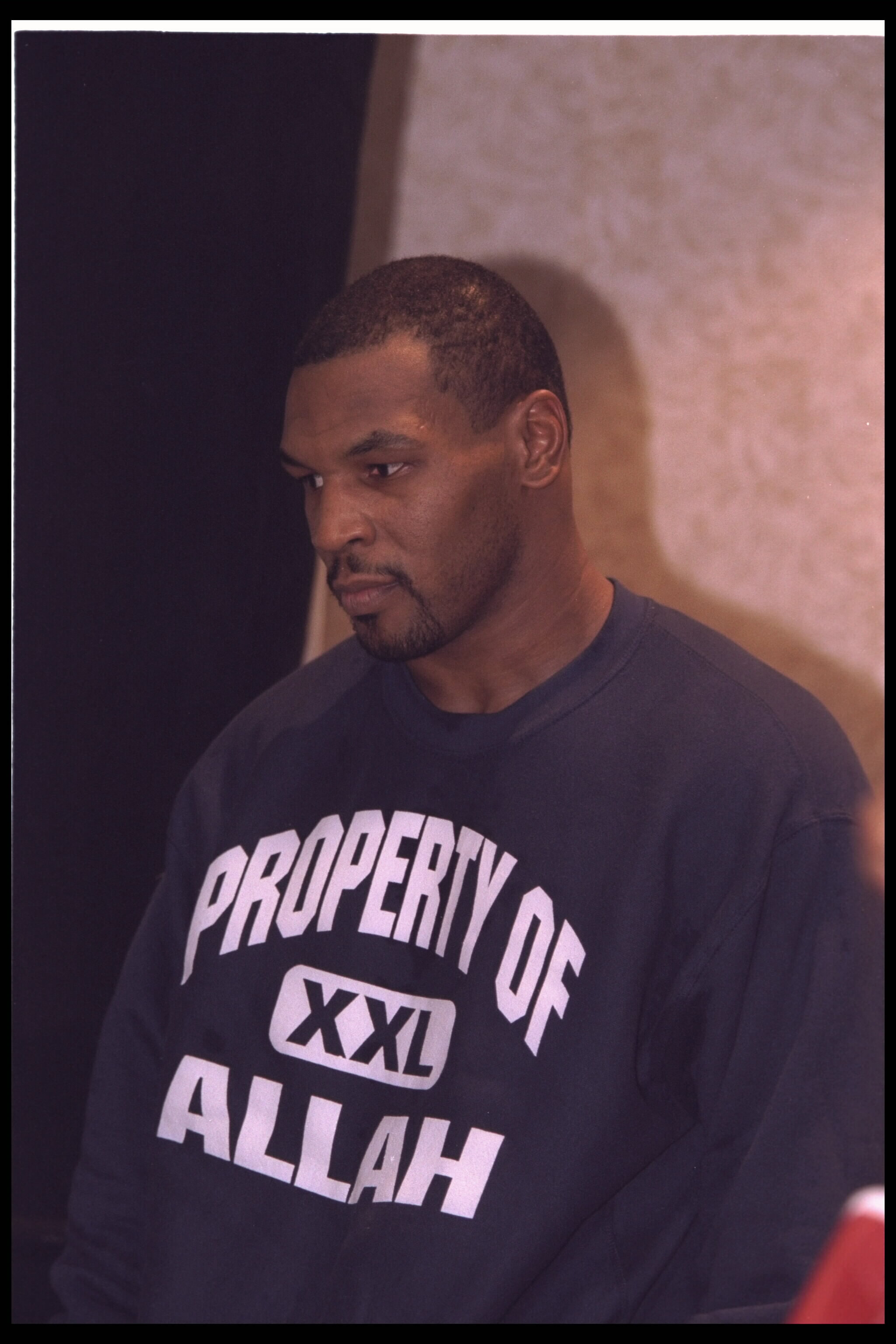 14 Dec 1995: Boxer Mike Tyson who has converted to Islam waits to be weighed for his fight with Buster Mathis Jr. Tyson knocked Mathis out in the third round in his second fight since being released from prison. Mandatory Credit: Simon Bruty/Allsport
