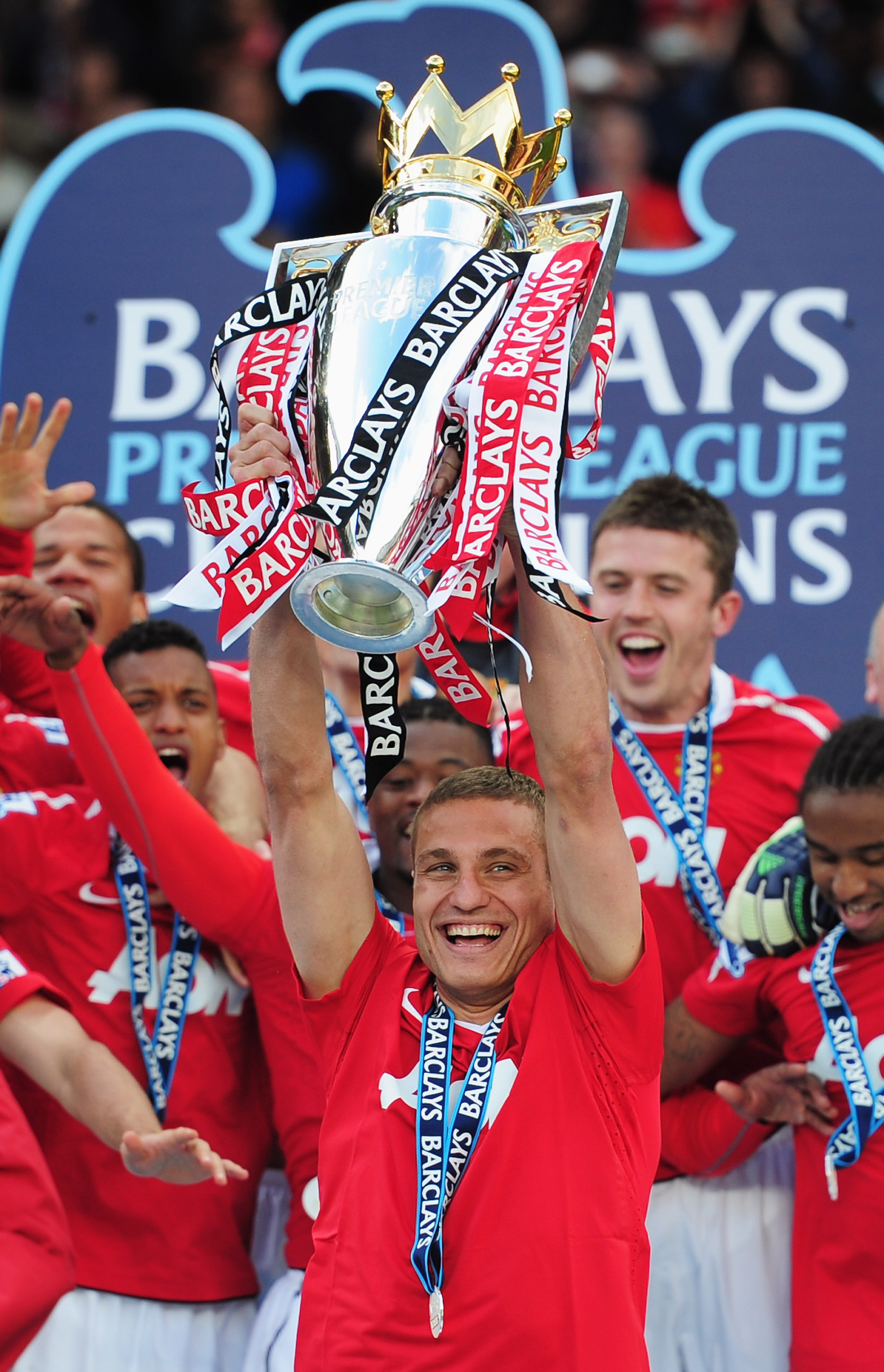 MANCHESTER, ENGLAND - MAY 22:  Captain Nemanja Vidic of Manchester United lifts the Premier League trophy after the Barclays Premier League match between Manchester United and Blackpool at Old Trafford on May 22, 2011 in Manchester, England. Manchester Un
