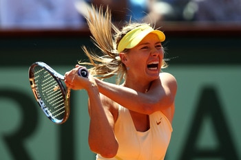 PARIS, FRANCE - JUNE 02: Maria Sharapova of Russia hits a backhand during the women's singles semi final match between Na Li of China and Maria Sharapova of Russia on day twelve of the French Open at Roland Garros on June 2, 2011 in Paris, France. (Phot