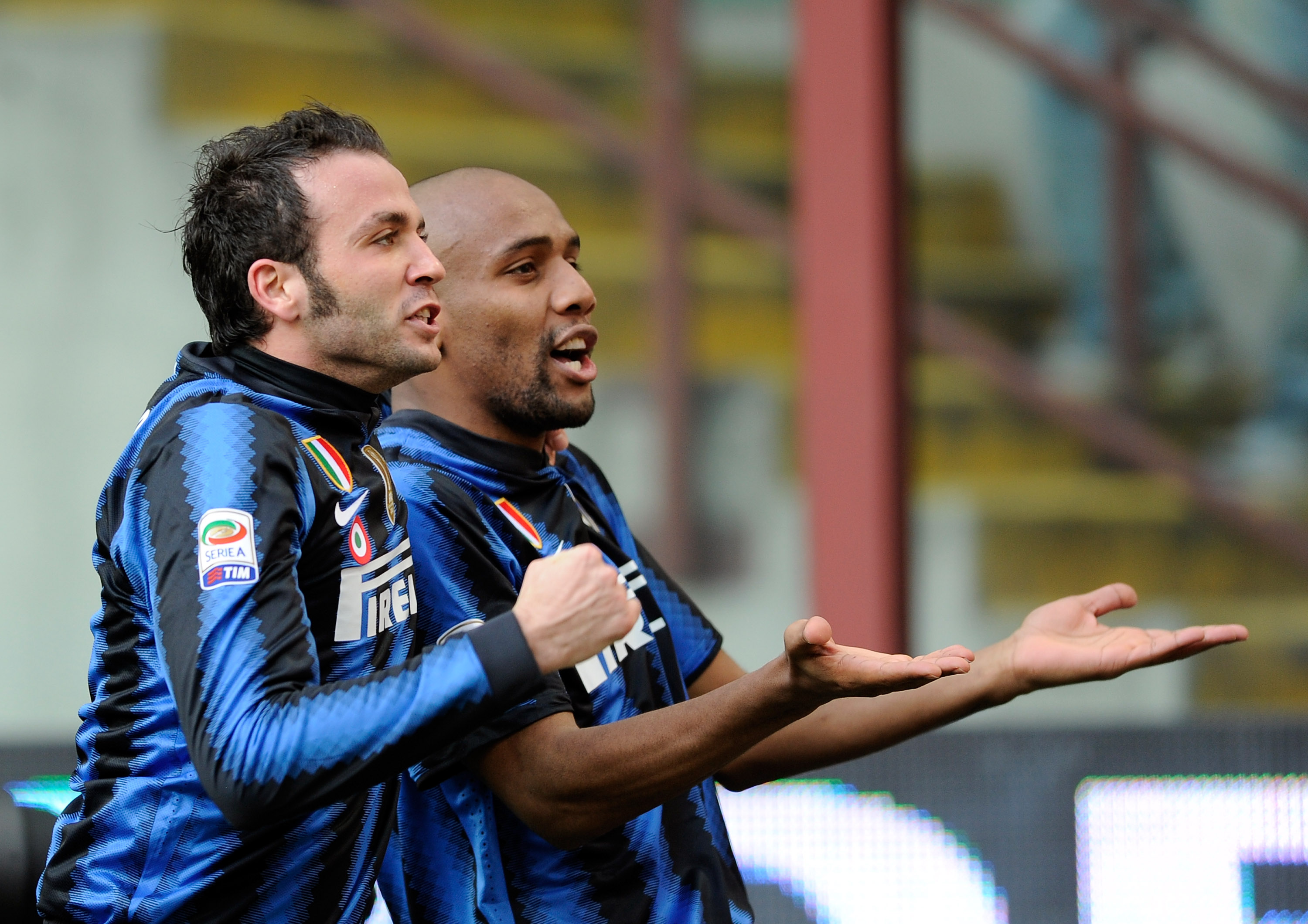 MILAN, ITALY - MARCH 06:  Giampaolo Pazzini of Inter Milan (L) celebrates scoring the opening goal with team--mate Maicon during the Serie A match between FC Internazionale Milano and Genoa CFC at Stadio Giuseppe Meazza on March 06, 2011 in Milan, Italy.
