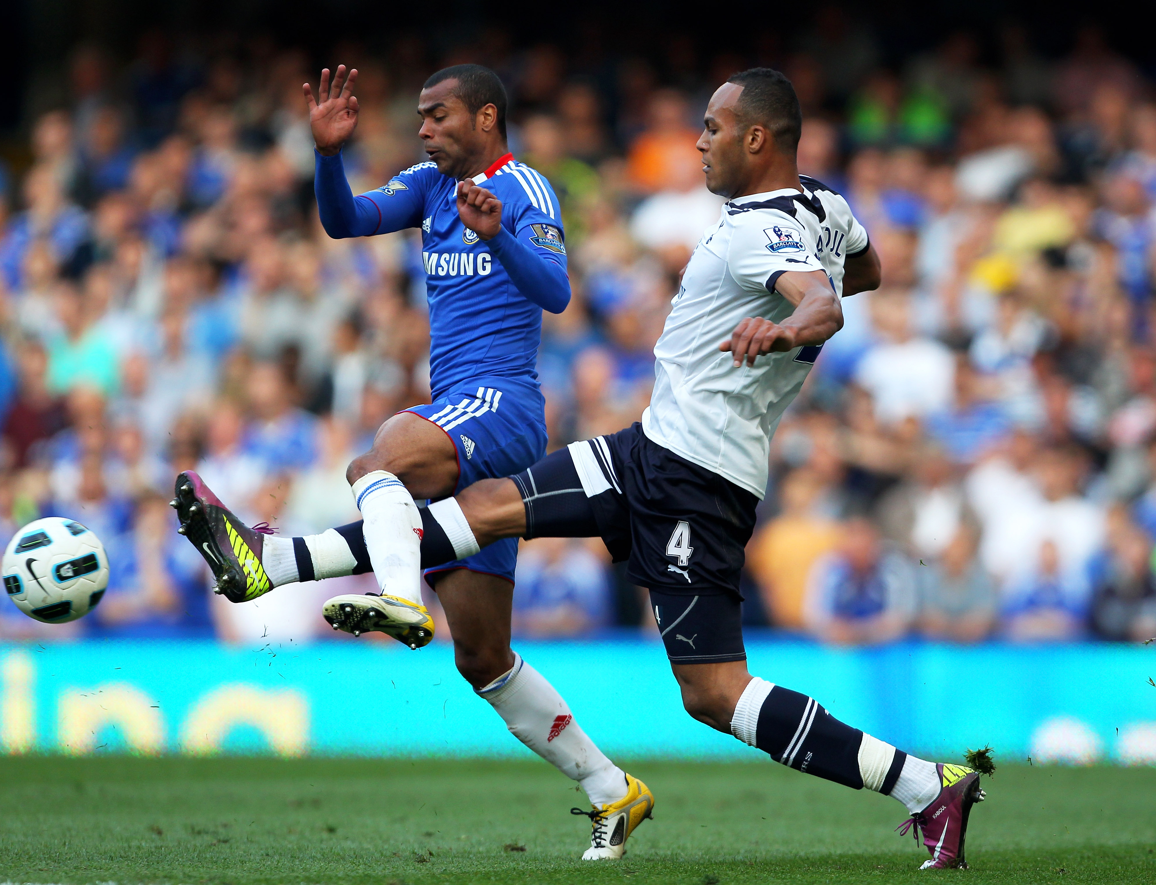 LONDON, ENGLAND - APRIL 30:  Ashley Cole of Chelsea and Younes Kaboul of Spurs compete for the ball during the Barclays Premier League match between Chelsea and Tottenham Hotspur at Stamford Bridge on April 30, 2011 in London, England.  (Photo by Clive Ro