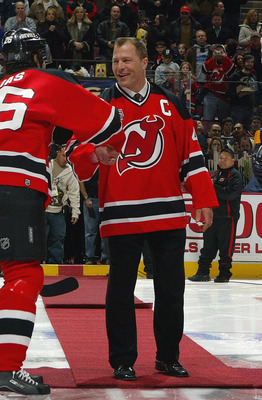 EAST RUTHERFORD, NJ - FEBRUARY 3:  Fomer defenseman Scott Stevens of the New Jersey Devils shakes hands with Patrik Elias #26 prior to the game against the Buffalo Sabres during their game on February 3, 2007 at Continental Airlines Arena in East Rutherfo