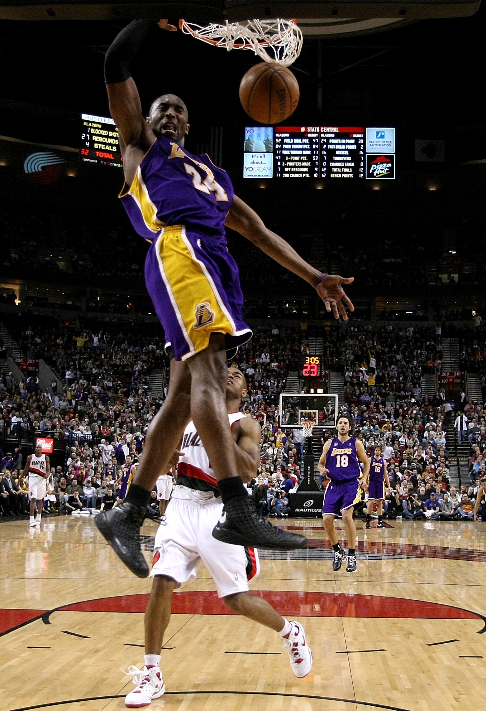 Los Angeles Lakers' Shaquille O'Neal dunks over Portland Trail