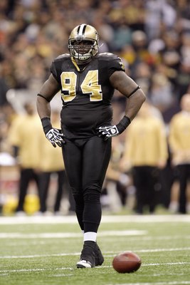 NEW ORLEANS - DECEMBER 27:  Charles Grant #94 of the New Orleans Saints walks on the field during the game against the Tampa Bay Buccaneers on December 27, 2009 at Louisiana Superdome in New Orleans, Louisiana. (Photo by Jamie Squire/Getty Images)
