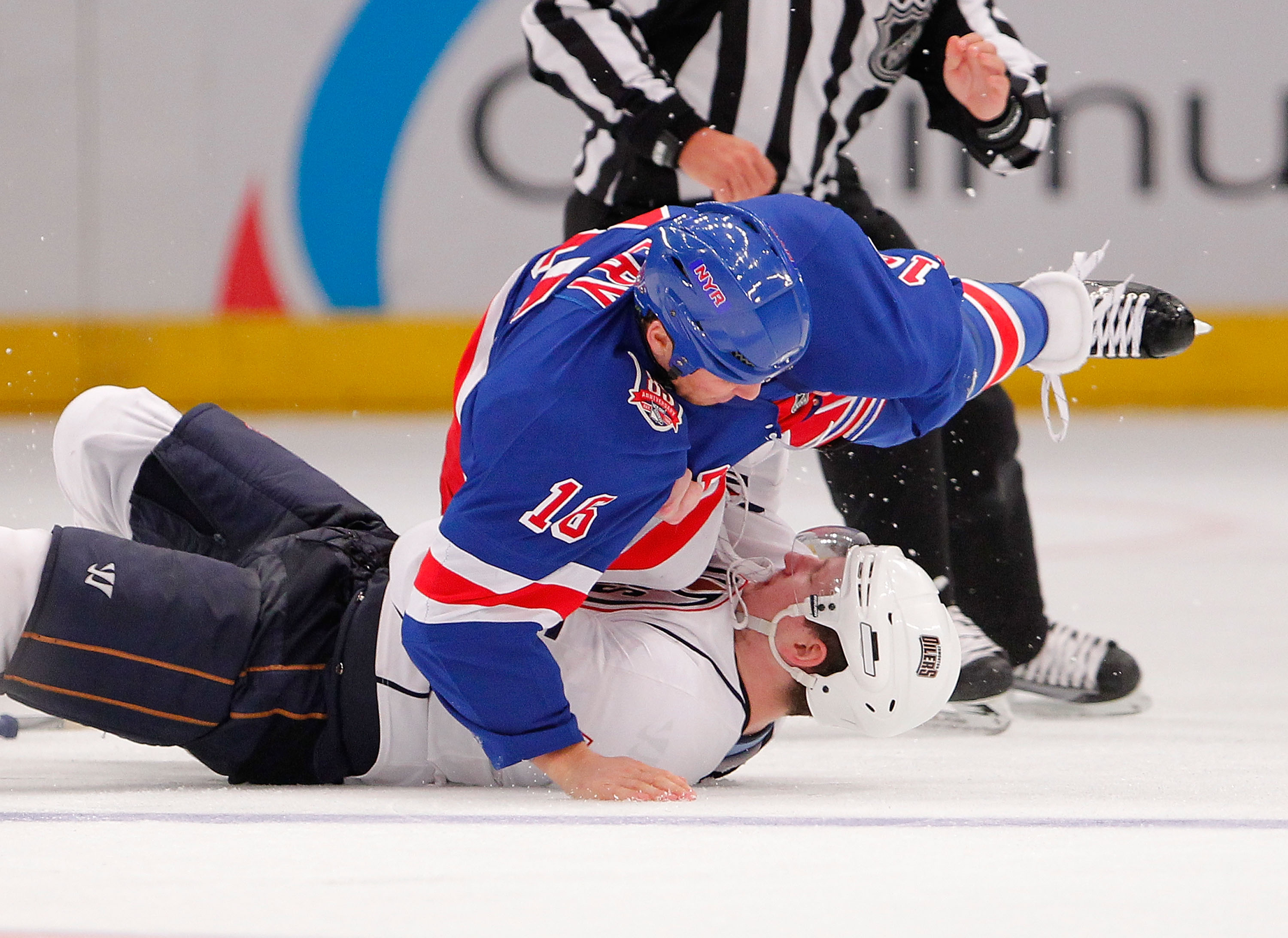 NEW YORK - NOVEMBER 14:  Ladislav Smid #5 of the Edmonton Oilers is on the bottom in a fight with Sean Avery #16 of the New York Rangers in the third period of a hockey game at Madison Square Garden on November 14, 2010 in New York City.  (Photo by Paul B