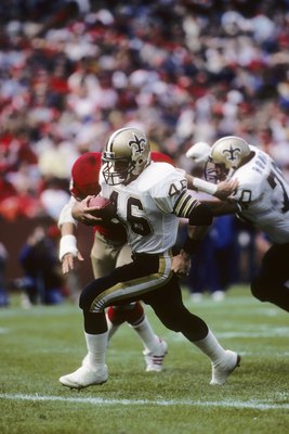 SAN FRANCISCO - SEPTEMBER 29:  Running back Hokie Gajan #46 of the New Orleans Saints finds room to run against the San Francisco 49ers defense during a game at Candlestick Park on September 29, 1985 in San Francisco, California.  The Saints won 20-17.  (