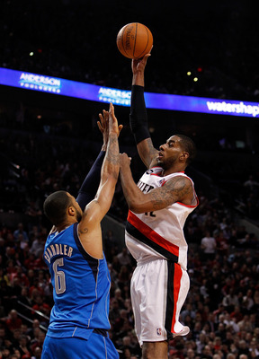 PORTLAND, OR - APRIL 21:  LaMarcus Aldridge #12 of the Portland Trail Blazers shoots against Tyson Chandler #6 of the Dallas Mavericks in Game Three of the Western Conference Quarterfinals in the 2011 NBA Playoffs on April 21, 2011 at the Rose Garden in P