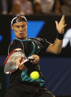 MELBOURNE, AUSTRALIA - JANUARY 18:  Lleyton Hewitt of Australia plays a forehand his first round match against David Nalbandian of Argentina during day two of the 2011 Australian Open at Melbourne Park on January 18, 2011 in Melbourne, Australia.  (Photo