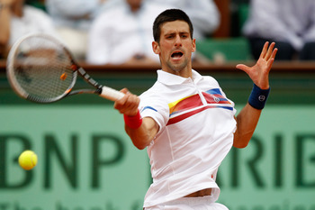 PARIS, FRANCE - JUNE 03:  Novak Djokovic of Serbia hits a forehand during the men's singles semi final match between Roger Federer of Switzerland and Novak Djokovic of Serbia on day thirteen of the French Open at Roland Garros on June 3, 2011 in Paris, Fr