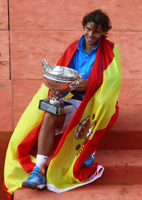 PARIS, FRANCE - JUNE 05:  Champion Rafael Nadal of Spain poses with the trophy following his victory during the men's singles final match between Rafael Nadal of Spain and Roger Federer of Switzerland on day fifteen of the French Open at Roland Garros on