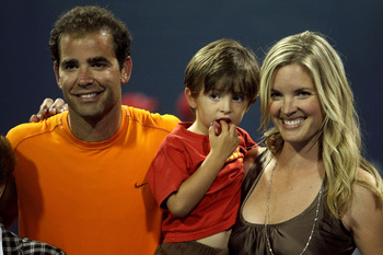 LOS ANGELES, CA - JULY 27:  Tournament honoree Pete Sampras poses for a portrait with son Ryan and wife Bridgette Wilson during the LA Tennis Open Day 1 at Los Angeles Tennis Center - UCLA on July 27, 2009 in Los Angeles, California.  (Photo by Stephen Du