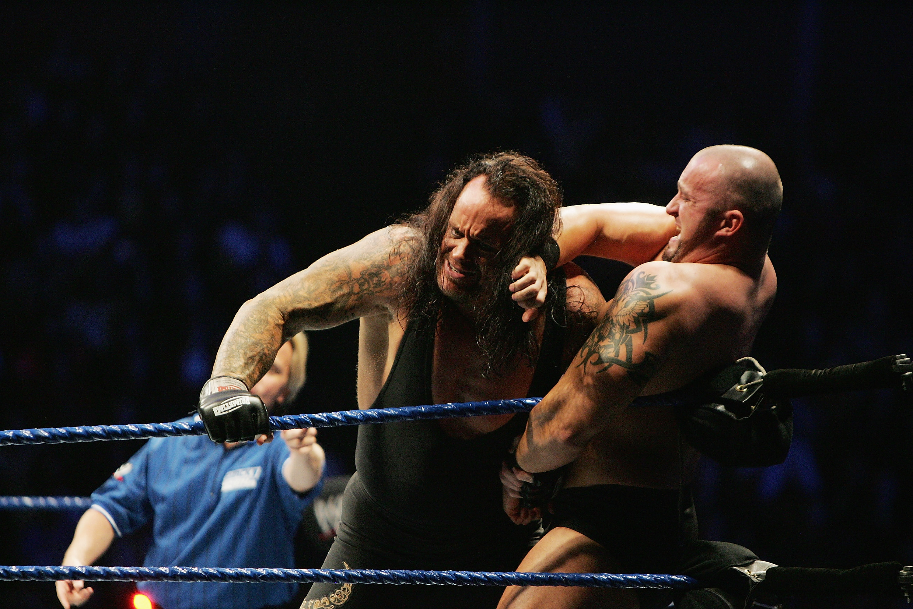 SYDNEY, AUSTRALIA - JUNE 15:  The Undertaker (L) pushes Bam Neely into the corner during WWE Smackdown at Acer Arena on June 15, 2008 in Sydney, Australia.  (Photo by Gaye Gerard/Getty Images)