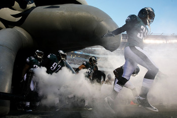 A fan holds a sign displaying the Philadelphia Eagles 11-1 record