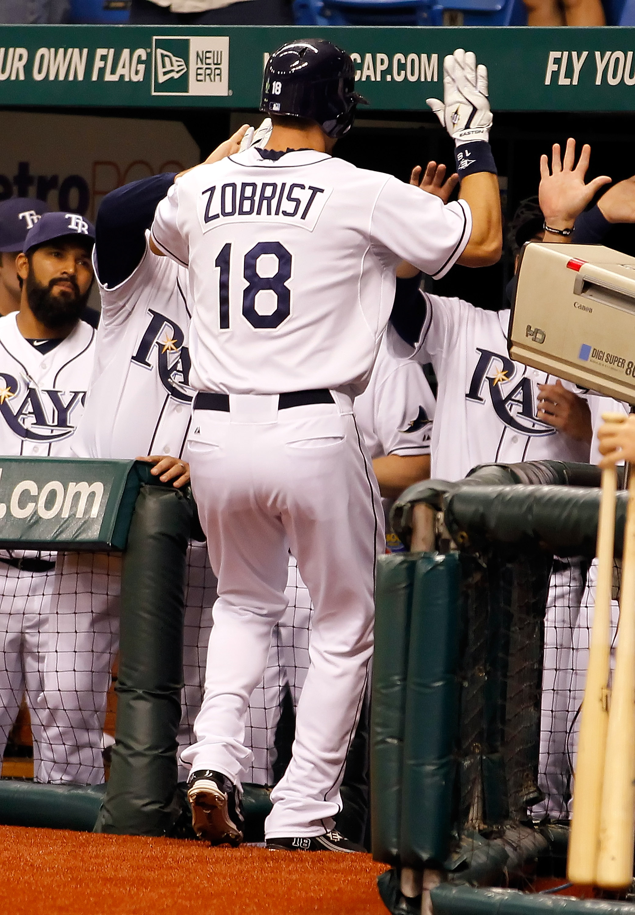 ST PETERSBURG, FL - APRIL 18:  Outfielder Ben Zobrist #18 of the Tampa Bay Rays is congratulated after his home run against the Chicago White Sox during the game at Tropicana Field on April 18, 2011 in St. Petersburg, Florida.  (Photo by J. Meric/Getty Im